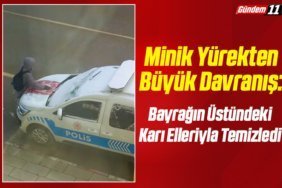 Bayrağın Üstündeki karı temizledi